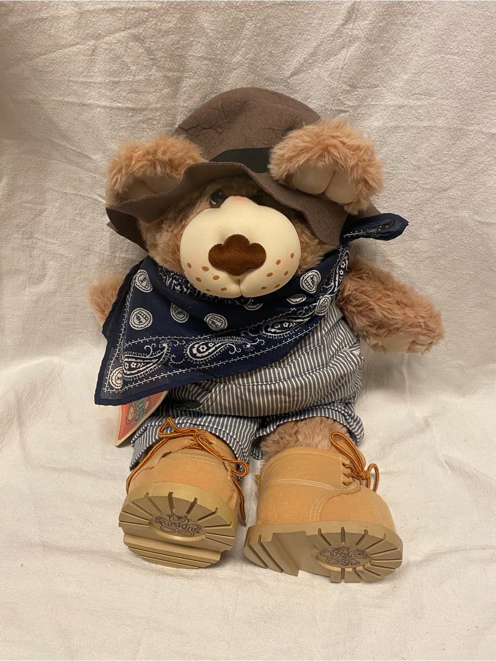 NWT. Vintage Dudley Furskin Teddy. Bandana, overalls, boots, storybook tag, hat